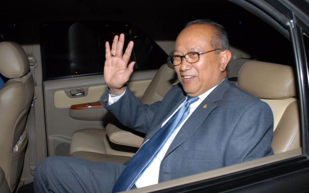 Indonesian ambassador to Canberra Nadjib Riphat Kesoema waves as he arrives at the Sukarno-Hatta airport in Tangerang on the outskirts of Jakarta on November 19, 2013