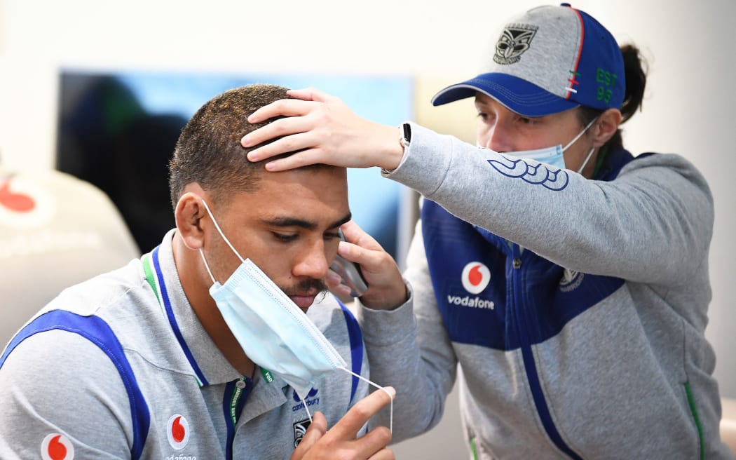 Isaiah Papalii gets his temperature taken. Warriors players leave today on a charter flight to travel to the Australian city of Tamworth in North West New South Wales to begin their 14-day quarantine