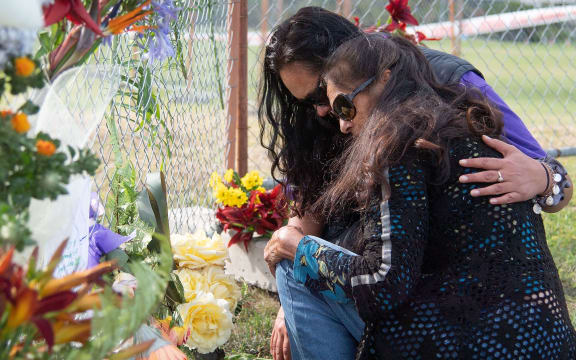 Bouquets of flowers are placed on the waterfront near White Island Tours base in Bay of Plenty, december 10, 2019 in memory of those who lost their lives during the volcano eruption in New Zealand.
