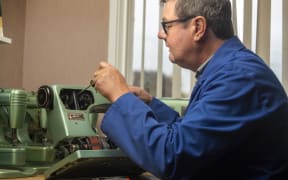 Sewing machine repairman Gary Hucker in Motueka, with Husqvarna Type 21 sewing machines.