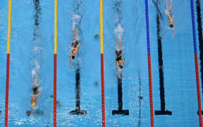 (L-R) Australia's Ariarne Titmus, USA's Katie Ledecky, Canada's Summer McIntosh and New Zealand's Erika Fairweather compete in the final of the women's 400m freestyle swimming event at the 2023 world championships in Fukuoka.