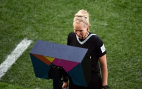 Match Referee Lina Lehtovaara checks the VAR system during the FIFA Women's Football World Cup