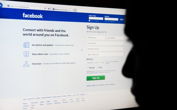 Man looking at Facebook. (file photo)