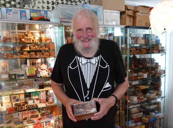 Louis Toorenburg with a Japanese puzzle box, one of the latest additions to his Puzzle Museum in Rāwene.