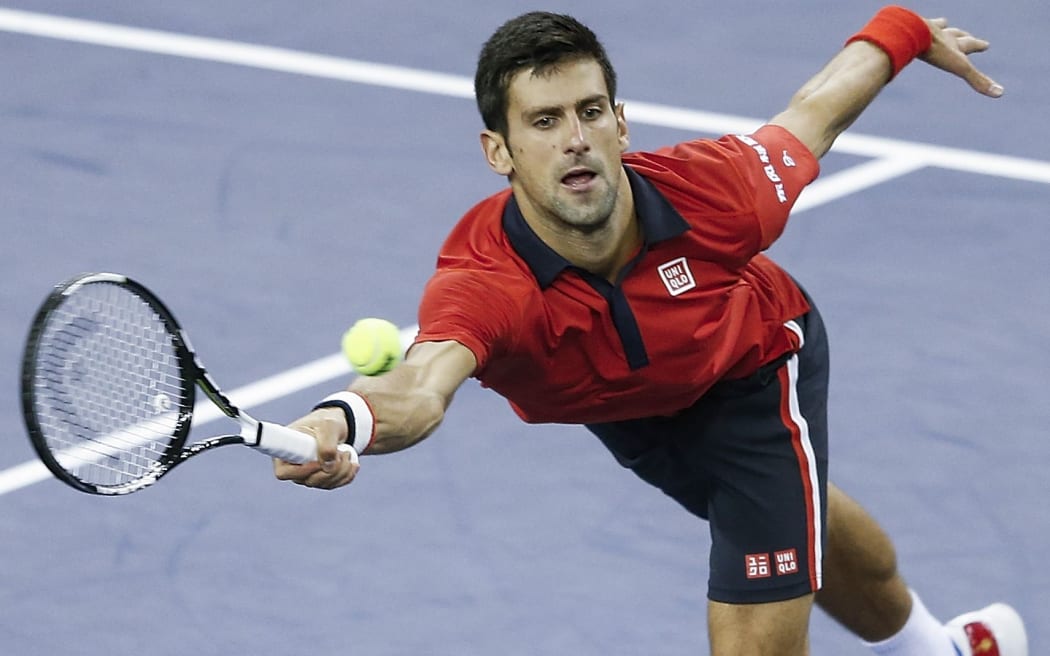 Novak Djokovic returns a shot against Andy Murray during the semifinal of the Shanghai Masters, 2015.
