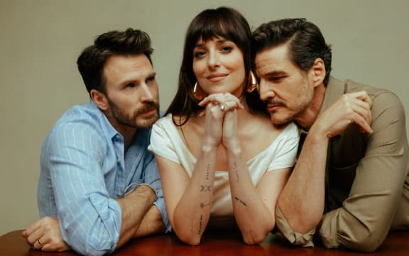 Chris Evans, Dakota Johnson and Pedro Pascal pose for the Materialists movie promotion.
