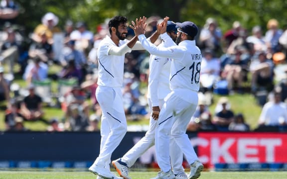 Jasprit Bumrah and Virat Kohli of India celebrates the wicket of BJ Watling 2020.
