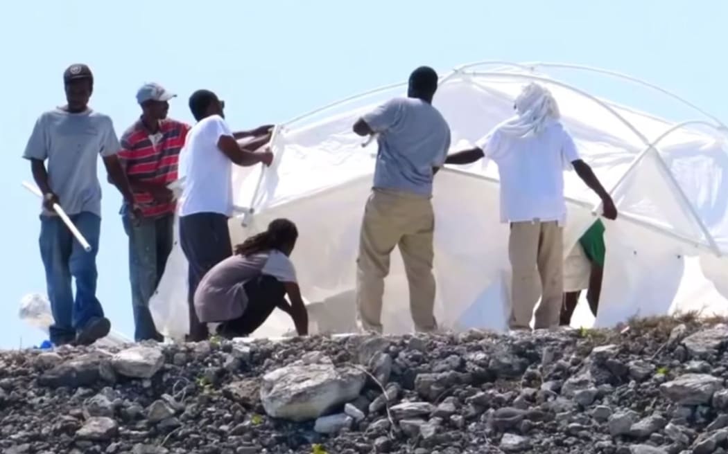 Workers erecting the 'luxury' tents at Fyre Festival (which turned out to be leftover hurricane tents)