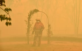 A fireman fights a bushfire to protect a property in Balmoral, 150 kilometres southwest of Sydney on December 19.