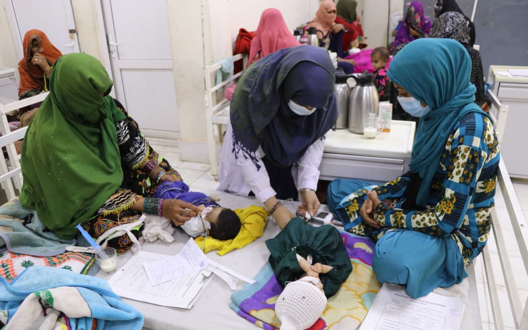 Babies and their mothers, struggling with hunger due to the food crisis, wait for treatment at Mir Veys Hospital as the number of children in clinics increase with economic crisis and the cessation of international aid to the country following the US withdrawal last year, in Kandahar, Afganistan on 1 November, 2022.