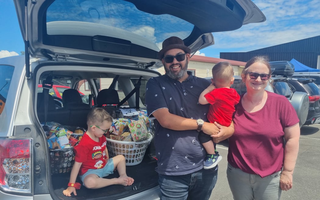 Paul Kumar,  with partner Jo, and children Elias and Amos were picking up a Christmas hamper to ease some of the pressure of Christmas.