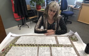 Jane Davis, Carterton District Council chief executive, with plans for the redevelopment of the town's Broadway