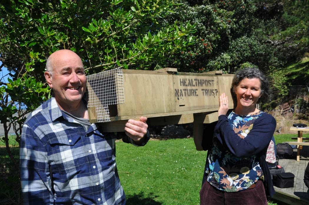 HealthPost Nature Trust chair Peter Butler and Onetahua Restoration project spokesperson Sky Davies with a trap.