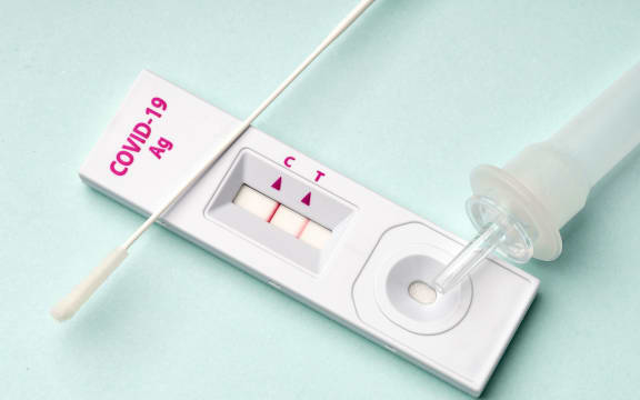 Rapid test device for COVID-19 virus with a positive result.