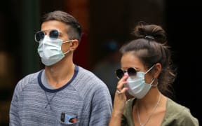 People wearing masks in Sydney, Australia, on March 28, 2020.