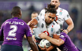 Warriors prop Isaiah Papali'i takes on the Melbourne defence.