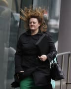 A woman outside Wellington Railway Station.