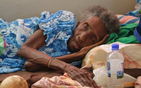 A woman in a special needs evacuation centre.