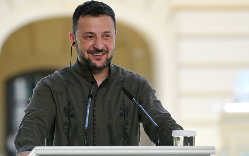Ukraine's President Volodymyr Zelensky gestures as he speaks to media during a joint press conference with the Polish President and Lithuanian Prime Minister following their meeting in Kyiv on August 24, 2024, amid the Russian invasion of Ukraine. (Photo by SERGEI CHUZAVKOV / AFP)