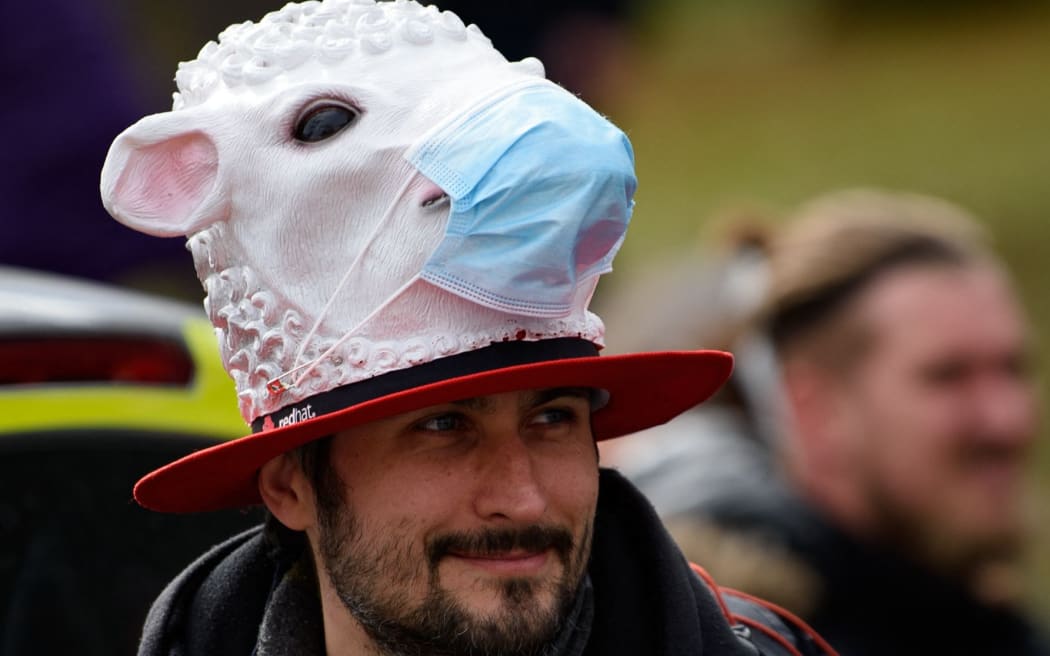 20 March 2021, Hessen, Kassel: A participant stands at a rally under the slogan "Free citizens Kassel - basic rights and democracy".