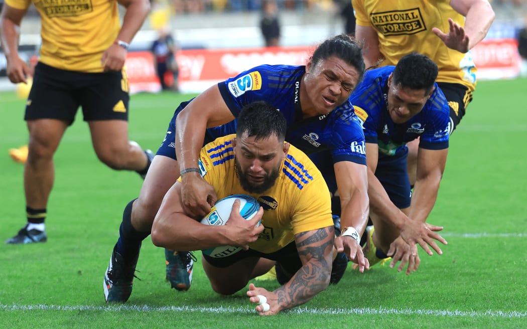 Hurricanes prop Tyrel Lomax scores a try with Blues’ Caleb Clarke during the Super Rugby Pacific - Hurricanes v Blues at Sky Stadium in Wellington on the 11th March 2023. © Copyright image by Marty Melville / www.photosport.nz