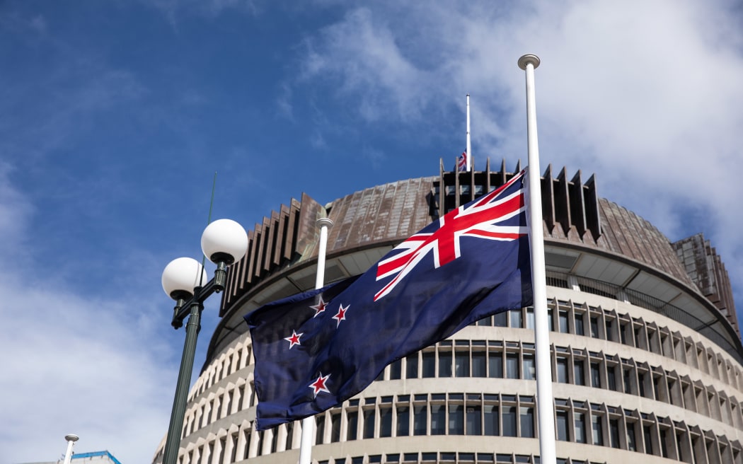 Flags at half mast in front of Parliament