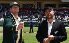 Captains Steve Smith (Australia) and Brendon McCullum (New Zealand) make the toss in the inaugural day-night cricket test,
