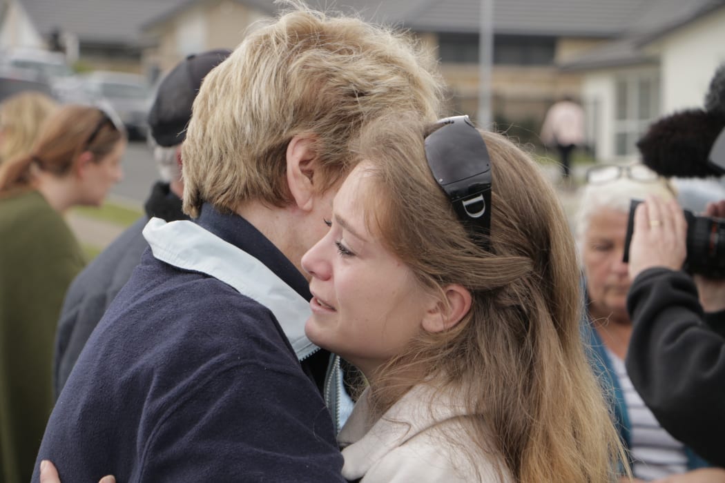 Former residents of the Bella Vista development comfort each other after announcing their rejection of the council's compensation offer.