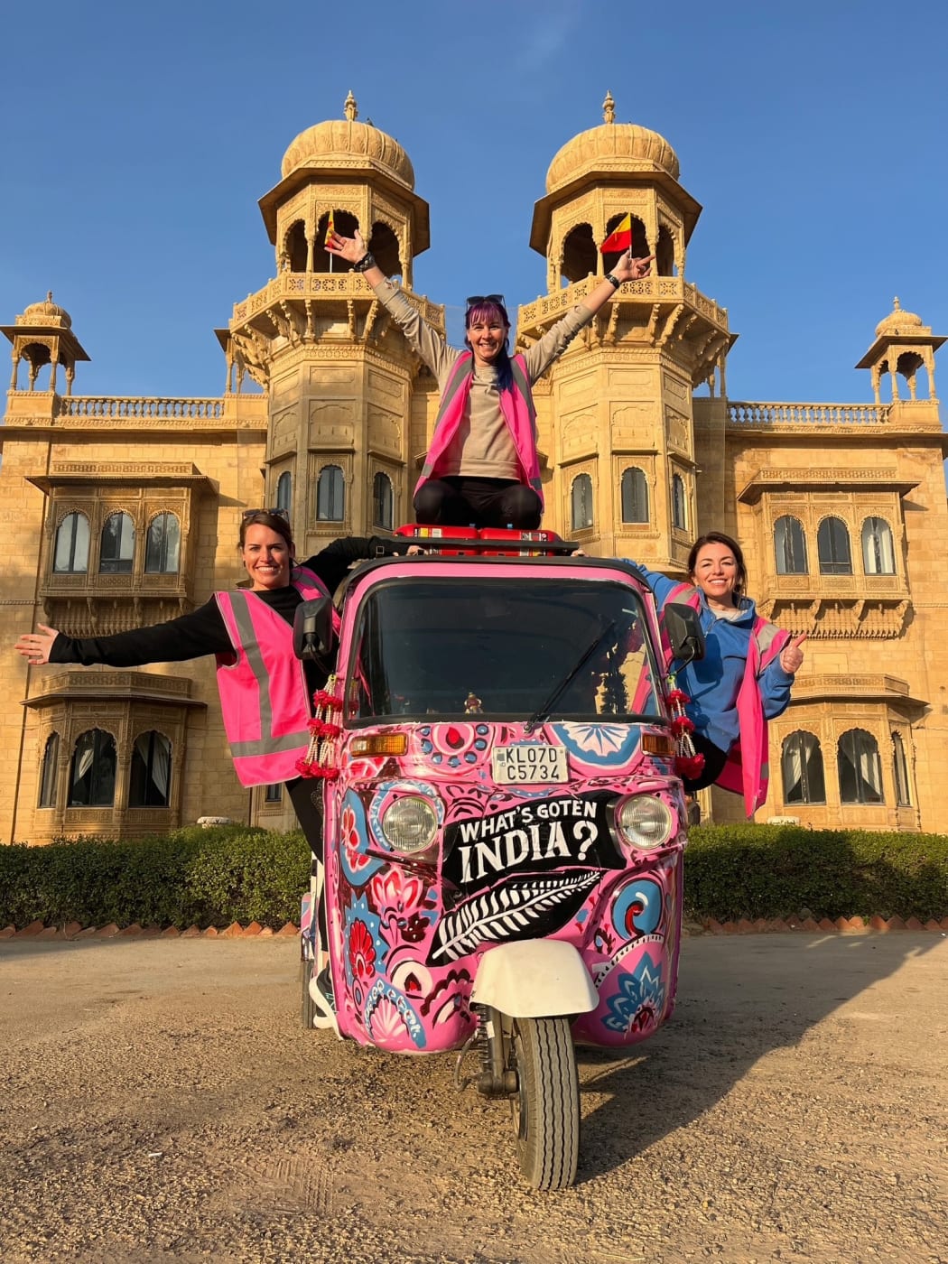 Kiwi adventurers, Ellen Richardson, Fiona Sandford and Clair Scott with their rickshaw in front of the Jaisalmer Fort in India.