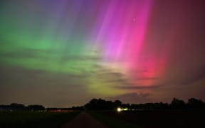 11 May 2024, Lower Saxony, Bersenbrück: Northern lights appear in the sky above Bersenbrück. Photo: Markus Hibbeler/dpa (Photo by Markus Hibbeler / DPA / dpa Picture-Alliance via AFP)