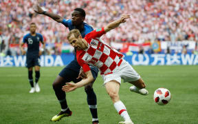 France's midfielder Paul Pogba and Croatia's defender Ivan Strinic vie for the ball during the Russia 2018 World Cup final football match between France and Croatia at the Luzhniki Stadium in Moscow.