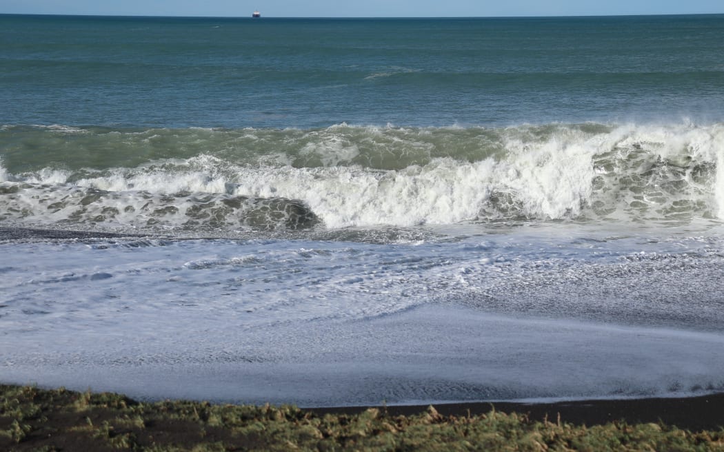 Huge waves crash on to the shoreline at Whirinaki