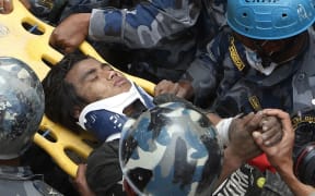 Pemba Tamang is pulled from the rubble of a hotel five days five days after the disastrous earthquake.