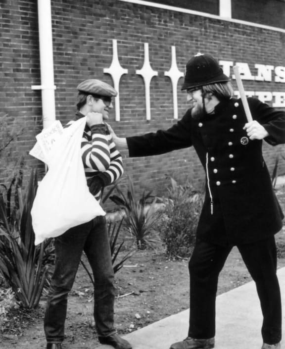 BLERTA actors Bruno Lawrence and Tony Barry ham it up in a keystone cops role, with the contents of the loot bag appearing to be copies of the controversial 70s underground magazine Cock.
