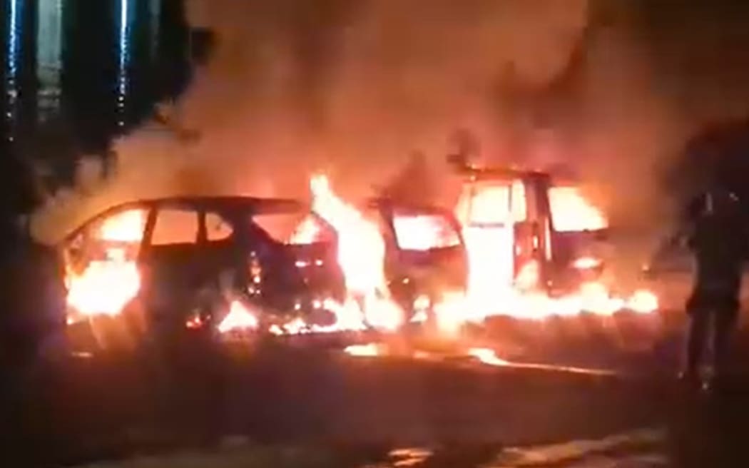 A photo posted on a local Facebook page shows three cars alight at Ferry Landing in Whitianga on 16 July 2024.