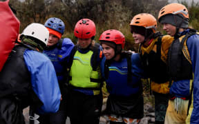 Year 11 Outdoor Ed students from Ellesmere College getting a river crossing pep-talk from their instructor.