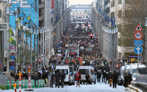 Demonstrators in Brussels, Belgium, protest at the use of restrictions aimed at stopping the spread of Covid-19, 21 November 2021.