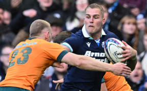 Scotland's wing Duhan van der Merwe in action against Australia, 2024.