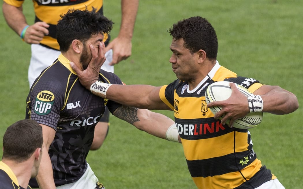 Taranaki's Seta Tamanivalu pushes Lions' Shaun Treeby out of the way during the Wellington v Taranaki. October 2014.