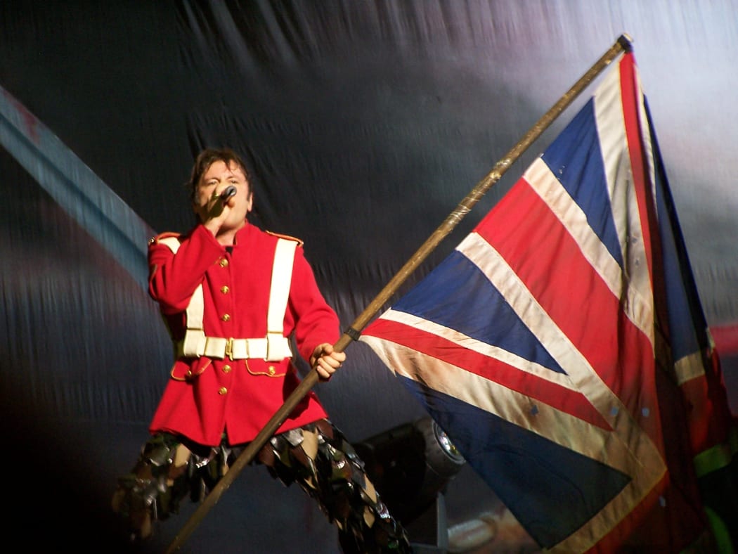 Bruce Dickinson on stage with iron Maiden.