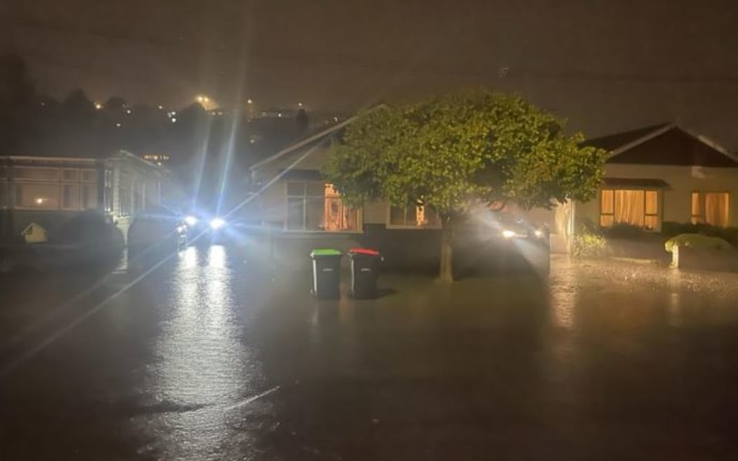 Residents of Surrey Street in Dunedin prepare to evacuate.