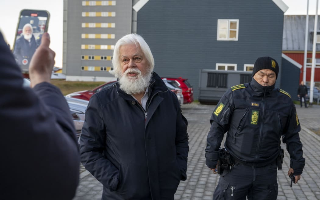 Anti-whaling activist Paul Watson arrives for a court hearing in Nuuk, Greenland, on October 2, 2024. - A Greenland court on Wednesday extended the detention of  Watson for three more weeks, pending a decision on his extradition to Japan, where he is wanted over a clash with whalers. For the third time since the 73-year-old US-Canadian campaigner's arrest in late July in Nuuk, the capital of the Danish autonomous territory, prosecutors had asked that Watson's detention be extended, as the legal review of Japan's extradition request drags on.