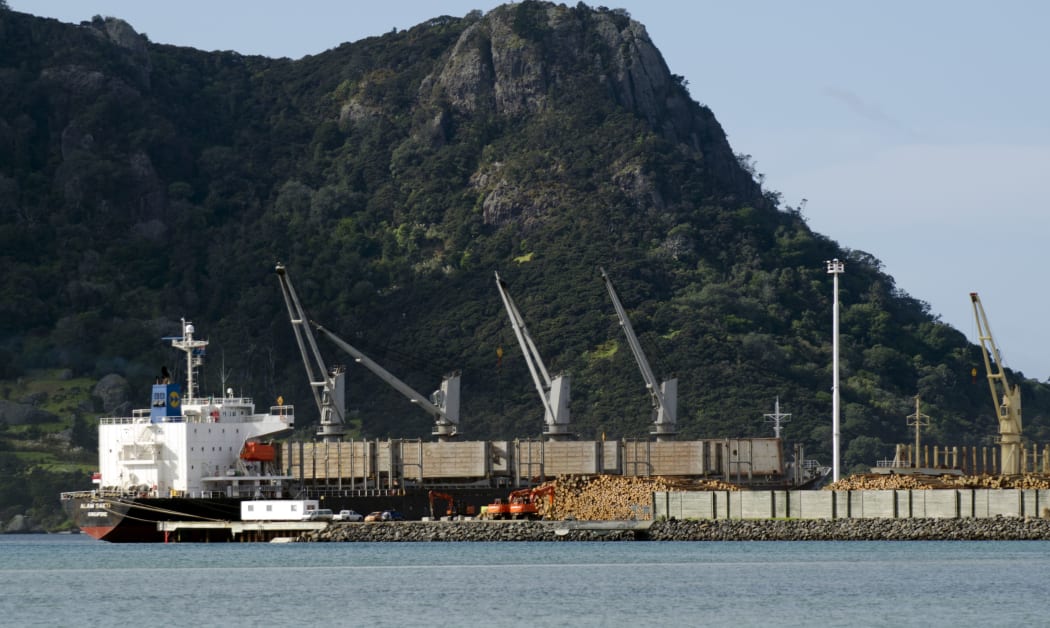 WHANGAREI,NZ - Ship, wood logs and cranes in Northport