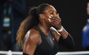 Serena Williams has won a record-breaking 23rd grand slam title at the Australian Open, beating her sister Venus 6-4 6-4.