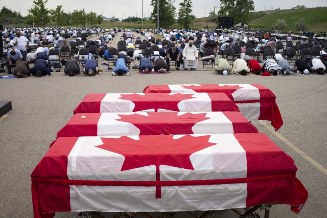 Mourners and supporters gather for a public funeral for members of the Afzaal family at the Islamic Centre of Southwest Ontario on June 12, 2021 in London, Canada.