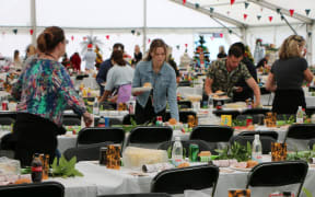 Volunteer Paige Vallance helps serve up food at the Christchurch City Mission lunch
