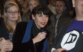 Pirate Party co-founder Birgitta Jonsdottir, centre, reacts as the election results are announced.