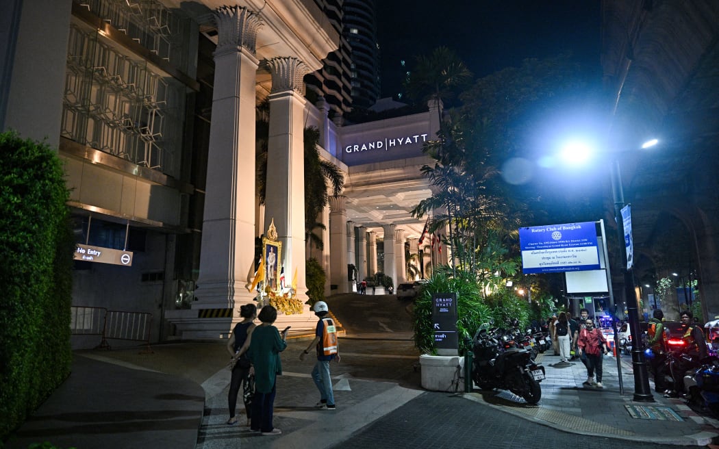 A general view of the street after an incident, in which six bodies were found at a hotel in Bangkok on July 16, 2024. (Photo by Lillian SUWANRUMPHA / AFP)