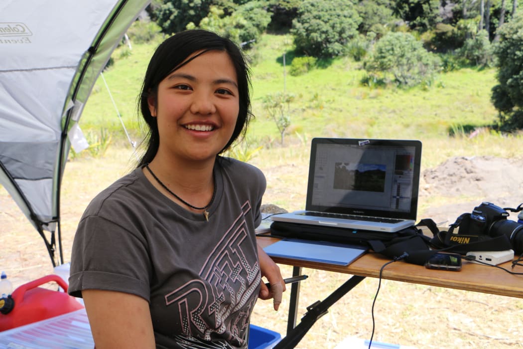 Site illustrator Krystal Wolfe at the dig site at Mangahawea Bay on Moturua Island.