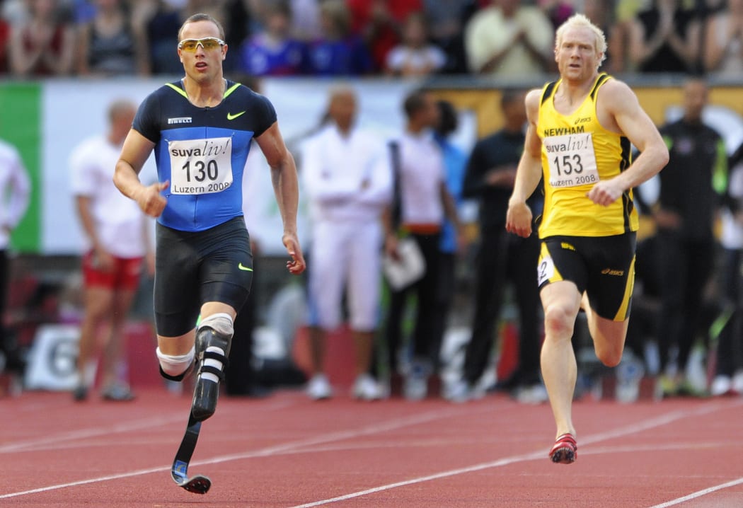 Double amputee South African Oscar Pistorius (L) competes with his carbon fibre blades next to British Thomas Iwan during his 400 metres race at the Athletics Meeting on July 16, 2008 in Lucerne.